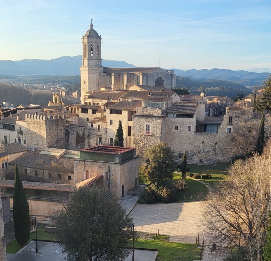 A view of Girona. The Pyrenees are visible in the background.