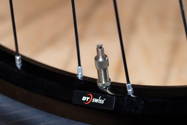 Detail photo: A Dunlop valve fitted in a bicycle rim