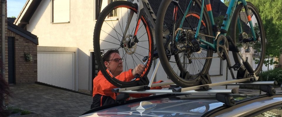 Mounting the bikes on the car.