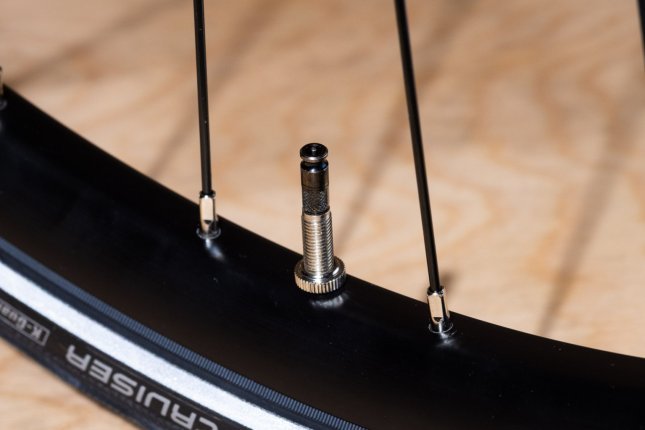 Detail photo: A Schwalbe Clik-Valve installed in a bicycle rim