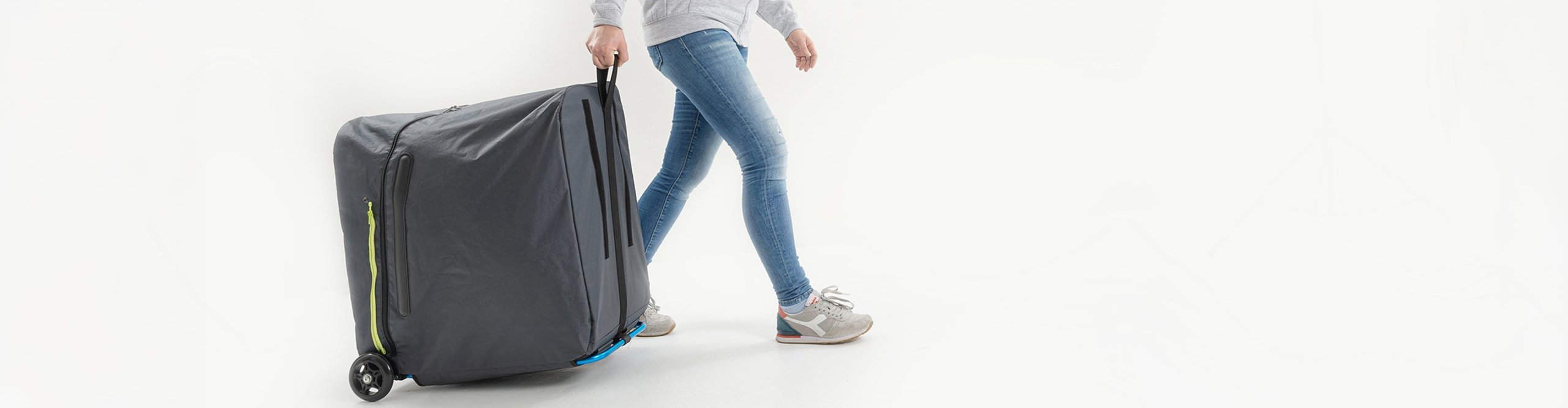 B&W foldon bag rolling transport bag being pulled by a person – large mobile travel bag for safe and convenient transport