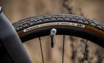 Pictured is a part of a Panaracer Gravelking SK gravel tyre. The tread of the tyre is clearly visible. 