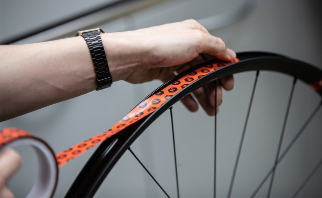 Tubeless rim tape seals the rims so that air cannot escape through the spoke holes.