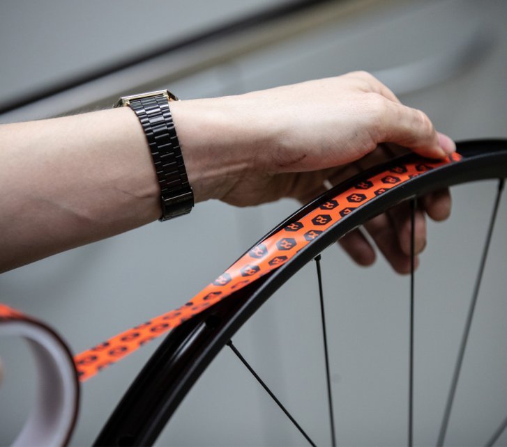 Tubeless rim tape seals the rims so that air cannot escape through the spoke holes.