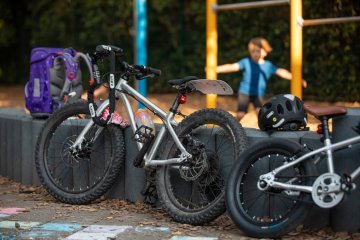 Kids bikes equipped with lights and accessories for everyday use, suitable for commuting and safe riding in traffic.
