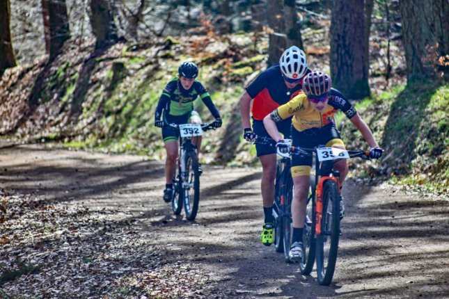 A group of three riders lead the race. 