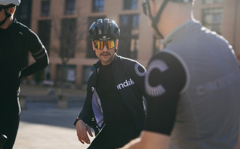 Franjo from the bc Team sits on the top tube of his bike before the ride.