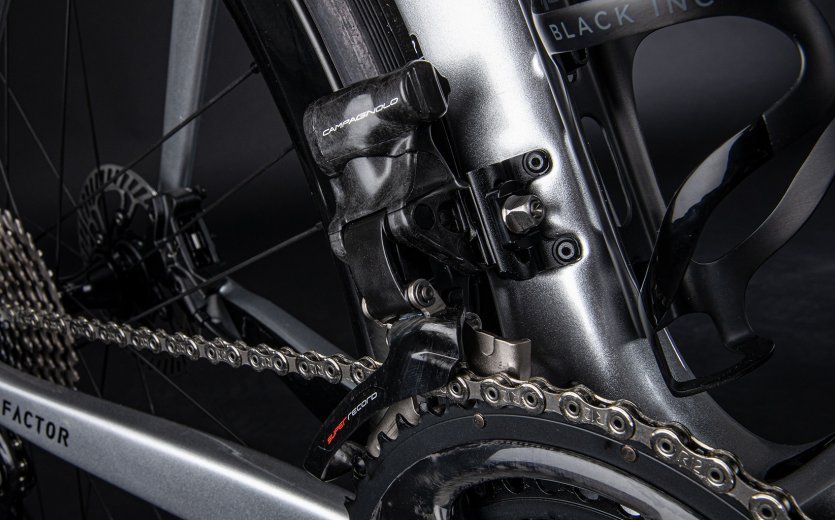 Close-up of a Campagnolo Super Record EPS front derailleur mounted on a Factor ONE.
