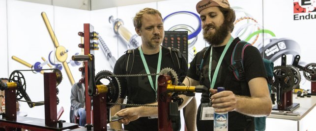 Drew and Sebastian checking out a drivetrain setup on display at Enduro Bearings. 