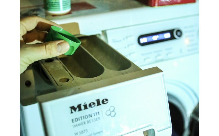 The functional detergent is either filled into the washing machine detergent drawer...