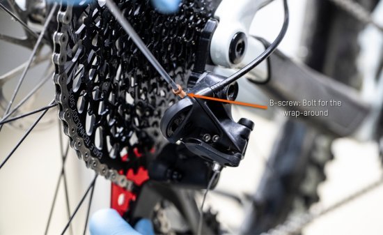 From above, bc mechanic uses a hex wrench on the B-bolt.