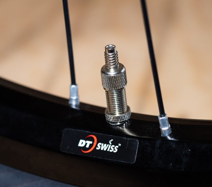 Detail photo: A Dunlop valve fitted in a bicycle rim
