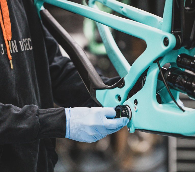 A bottom bracket is bolted to a Santa Cruz Bronson.