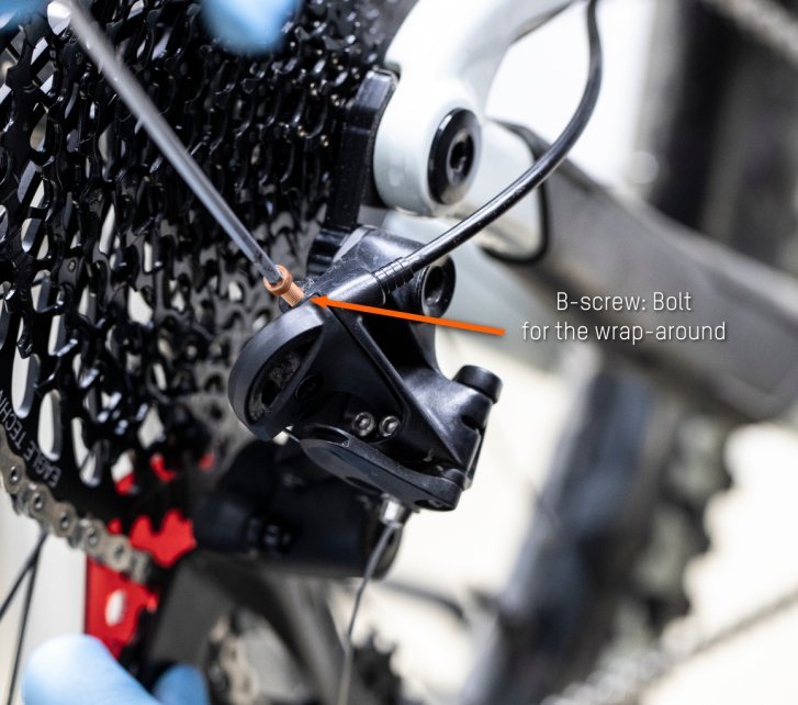 From above, bc mechanic uses a hex wrench on the B-bolt.