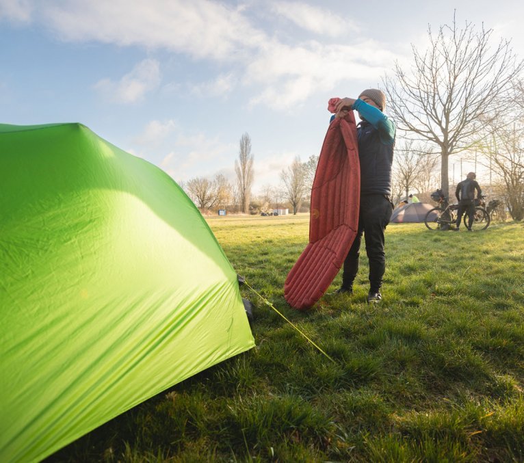 Marcel from bc Marketing lets the air out of his camping mat.