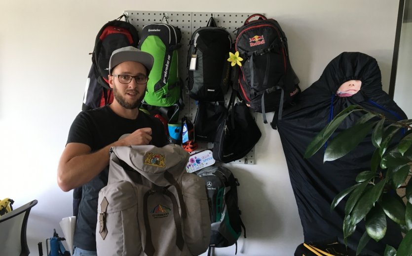 Martin Zanker, head of sales for cycling shows off a custom backpack made for Angela Merkel.