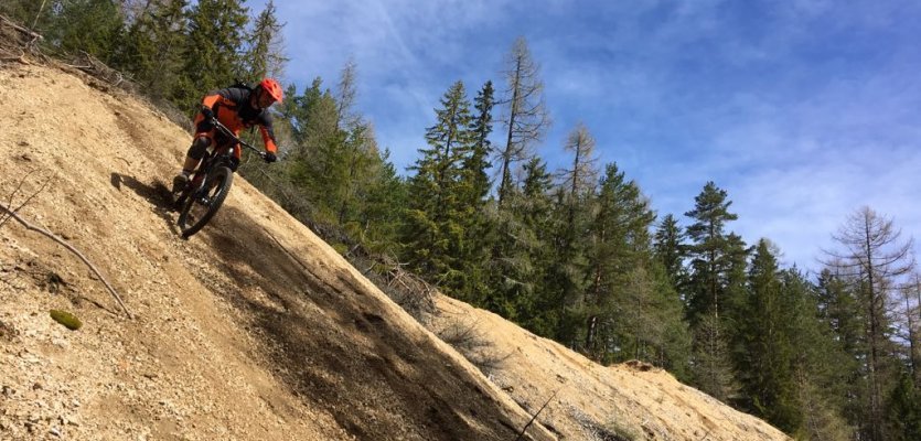 Surfing down a loose gravel grade.