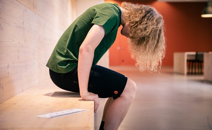 Choose a pair of thin pants with minimal seams on the butt and sit down squarely on the cardboard! 
