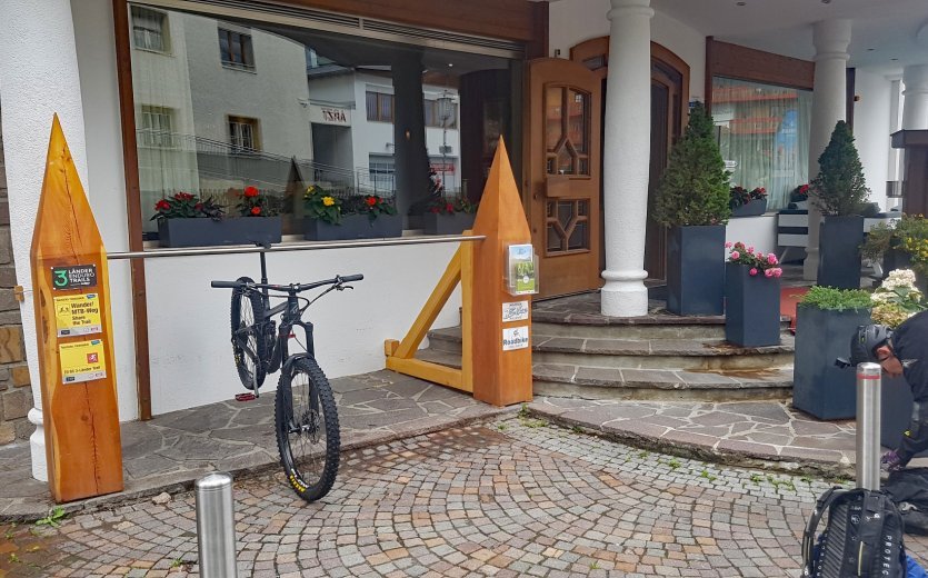 Bike stands in front of the hotel.