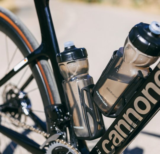 The Cannondale bike's bottle cages and bottles are angular in shape.