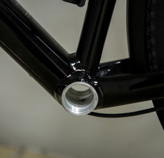 Pictured is the bottom bracket shell of a Specialized Diverge. There is a thread for mounting the bottom bracket.