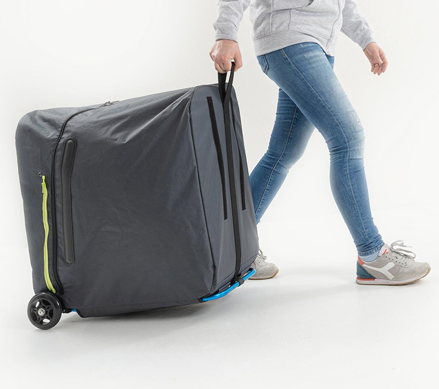 B&W foldon bag rolling transport bag being pulled by a person – large mobile travel bag for safe and convenient transport