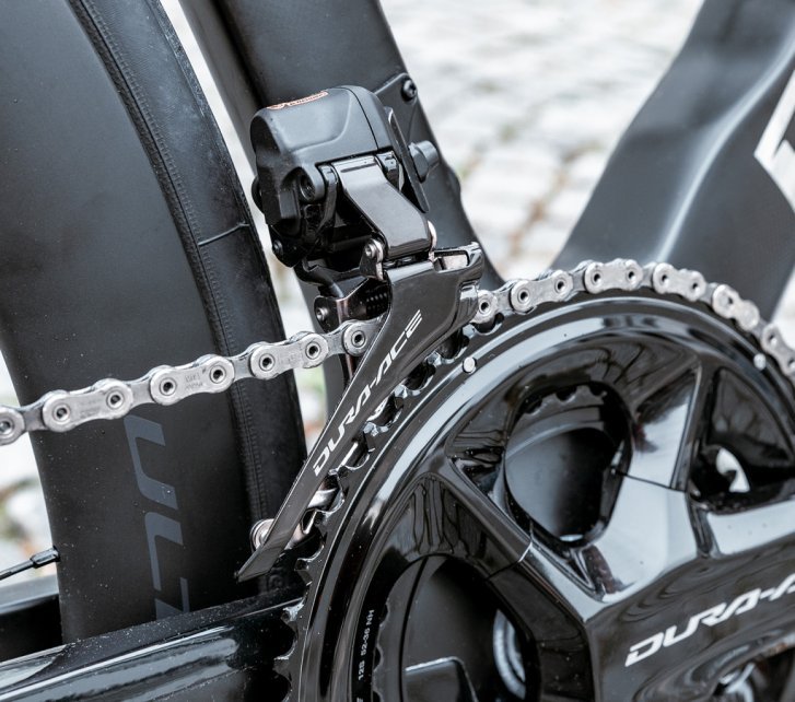 Shown here is a Shimano Dura-Ace Di2 front derailleur installed on a road bike.