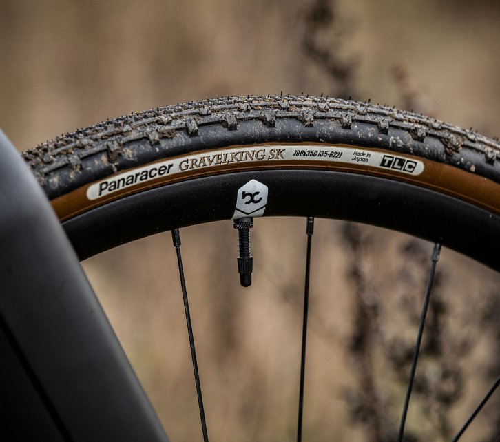 Pictured is a part of a Panaracer Gravelking SK gravel tyre. The tread of the tyre is clearly visible. 