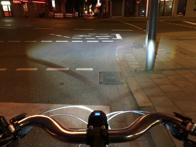 The powerful beam is even visible under a bright street light.