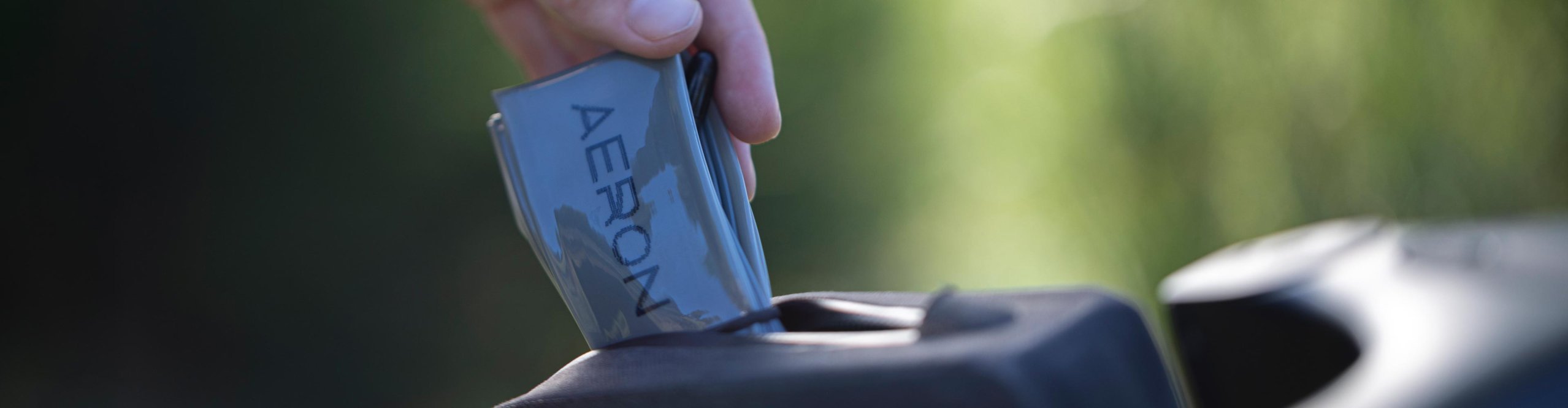 Compact folded AERON/TPU gravel bike inner tube being stored as a spare in a bike bag.