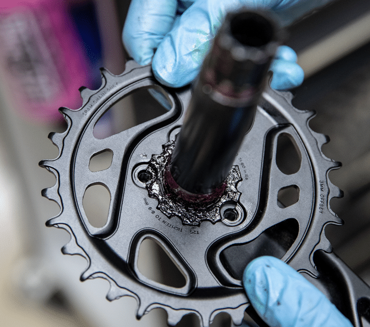 Our mechanic holds in his hands a single crank. 