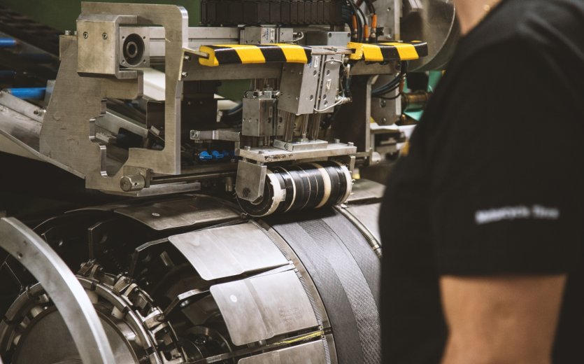 The Continental BlackChili compound tread being pressed on the building drum.