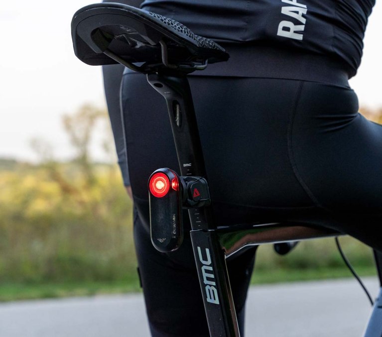 KOM Cycling mount for Garmin Varia radar with mounted rear light on a road bike for improved visibility and safety