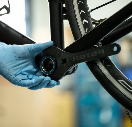 A bottom bracket is screwed on with the help of a Rotor bottom bracket tool.