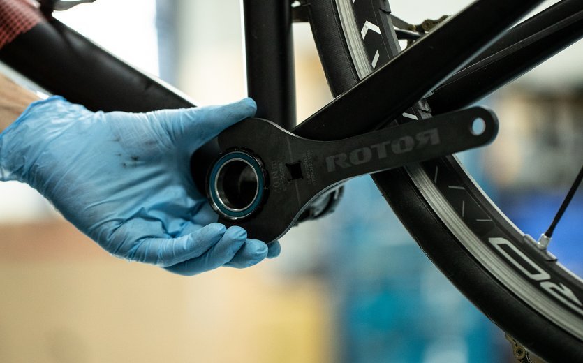 A bottom bracket is screwed on with the help of a Rotor bottom bracket tool.