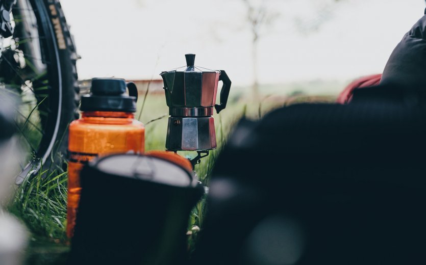 An espresso pot is used to make coffee at the campsite. 