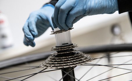 The plastic cylinder that serves as a carrier for the sprockets is pulled off. 