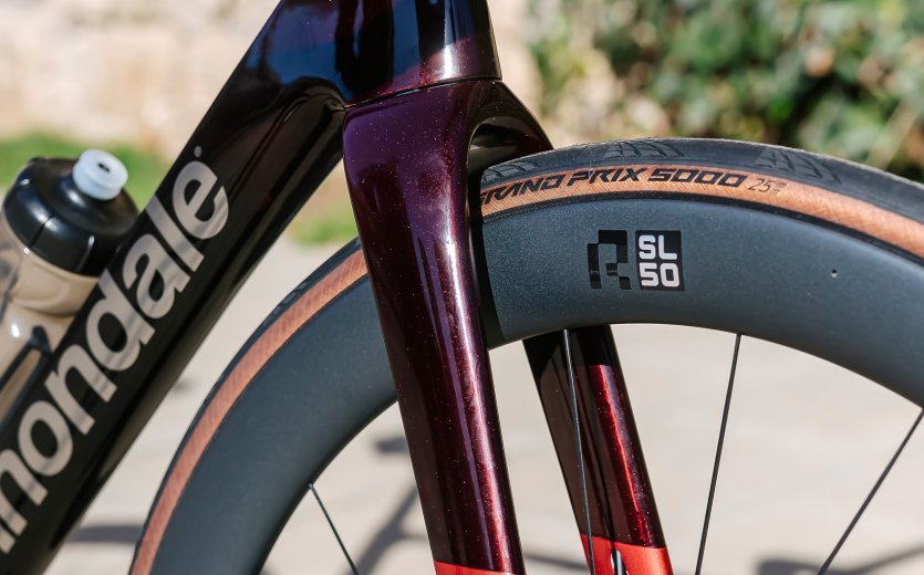 Pictured is the fork and front wheel of the SuperSix EVO. There is still room for very wide tyres. 