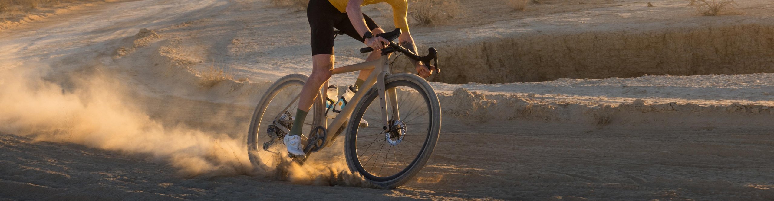 Discover Shimano offers with a cyclist on a dusty trail as a hero image for discounted Shimano products