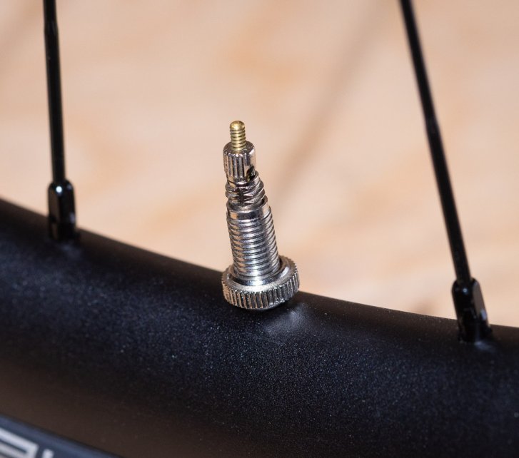 Detail photo: A Presta valve installed in a bicycle rim