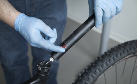 Our mechanic greases the remote seat post of a Scott mountain bike. 