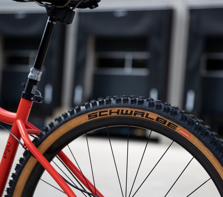 Pictured is the rear triangle of a Chromag MTB. The wheel is fitted with a Schwalbe tyre with Tanwall.