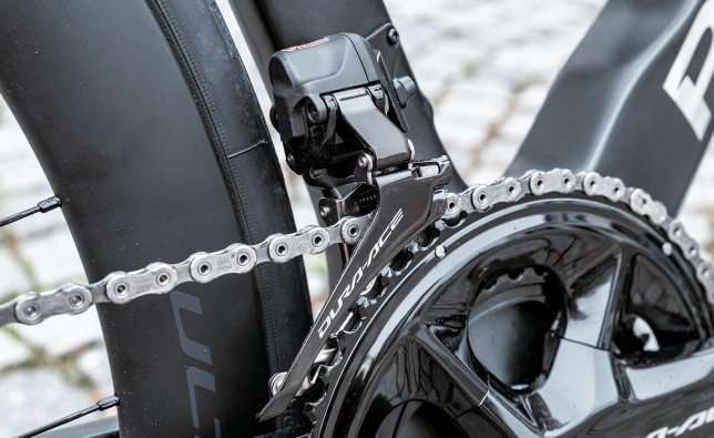 Shown here is a Shimano Dura-Ace Di2 front derailleur installed on a road bike. 