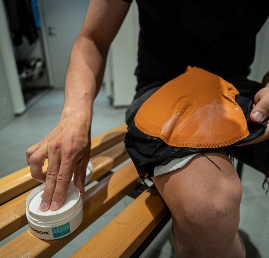 Fabian from bc marketing applies Assos Chamois cream to his bc original Race Bib.