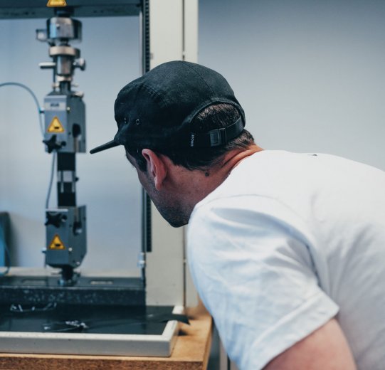 Pictured is a machine for testing the tensile strength of welded seams.