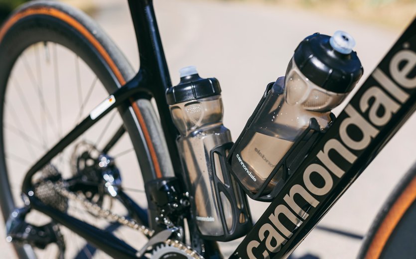 The Cannondale bike's bottle cages and bottles are angular in shape.