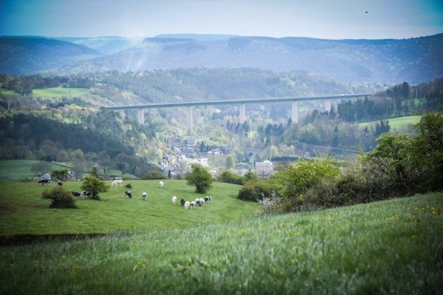 The freeway bridging a valley gives an idea of the Ardennes road bike roller coaster. 