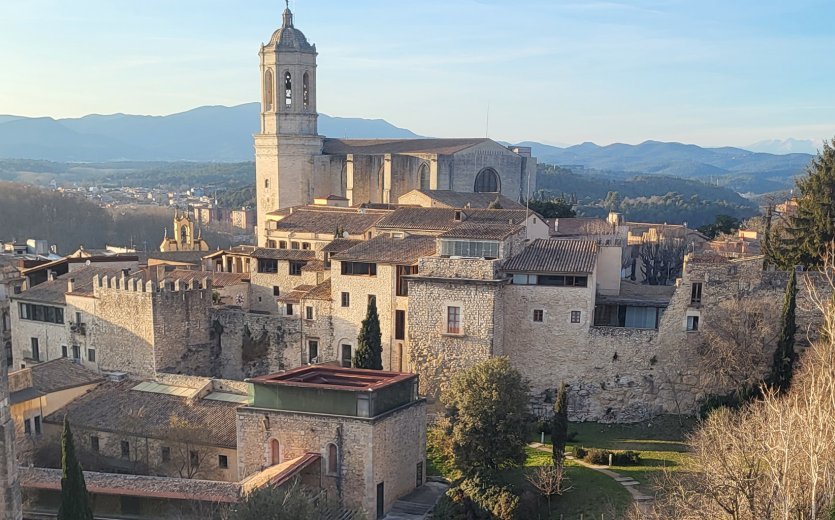 A view of Girona. The Pyrenees are visible in the background.