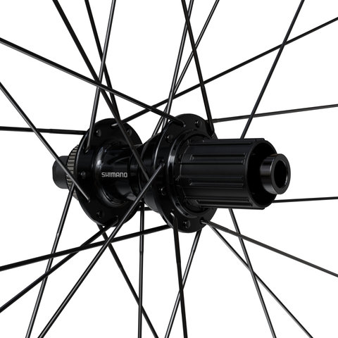 Shimano Juego de Ruedas Logo WH-RX180 Disc Center Lock 28" - negro/28"/Shimano carretera/142 mm/100 mm/Non Boost/Non Boost