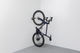 Tons Soporte de pared vertical para bicicletas - natural oak/38 mm